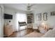 Charming bedroom featuring a ceiling fan, desk, shelving, and a comfortable chair at 6349 N 78Th St # 105, Scottsdale, AZ 85250