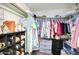 Spacious walk-in closet with ample hanging space, shelving, and drawers for organization at 6349 N 78Th St # 105, Scottsdale, AZ 85250
