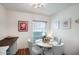 Cozy dining area with round table, gray chairs, and a window for natural light at 6349 N 78Th St # 105, Scottsdale, AZ 85250