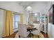 Formal dining room with chandelier, mirror, and yellow curtains at 6349 N 78Th St # 105, Scottsdale, AZ 85250