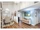Open-concept dining room with chandelier, buffet, and view to the kitchen at 6349 N 78Th St # 105, Scottsdale, AZ 85250