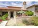Charming single-story home with a red tile roof, front patio and desert landscaping at 6349 N 78Th St # 105, Scottsdale, AZ 85250