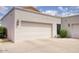 Attached two-car garage with ample driveway space provides convenient parking and storage at 6349 N 78Th St # 105, Scottsdale, AZ 85250