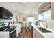 Bright kitchen with white cabinets, stainless steel appliances, and adjacent dining area at 6349 N 78Th St # 105, Scottsdale, AZ 85250