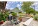 Outdoor patio featuring a dining set with umbrella and golf course views at 6349 N 78Th St # 105, Scottsdale, AZ 85250