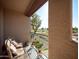 Relaxing balcony view with cozy seating overlooking the lush golf course at 6535 E Superstition Springs Blvd # 217, Mesa, AZ 85206