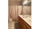 Bathroom features a bathtub with shower and vanity at 6535 E Superstition Springs Blvd # 217, Mesa, AZ 85206