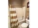 Compact bathroom features a shower/tub combo with neutral tile and a toilet at 6535 E Superstition Springs Blvd # 217, Mesa, AZ 85206