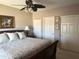 Comfortable bedroom features a decorative ceiling fan, and light walls at 6535 E Superstition Springs Blvd # 217, Mesa, AZ 85206