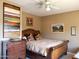 Cozy bedroom with stylish furniture, warm lighting, and decorative wall art at 6535 E Superstition Springs Blvd # 217, Mesa, AZ 85206