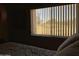 Cozy bedroom features a window view of the community golf course and outdoor scenery at 6535 E Superstition Springs Blvd # 217, Mesa, AZ 85206