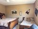 Comfortable bedroom featuring two beds, neutral walls, and carpeted floors at 6535 E Superstition Springs Blvd # 217, Mesa, AZ 85206