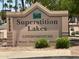 Superstition Lakes Condominiums signage showing resort community near water at 6535 E Superstition Springs Blvd # 217, Mesa, AZ 85206