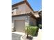 Exterior elevation features garage and a well landscaped front at 6535 E Superstition Springs Blvd # 217, Mesa, AZ 85206