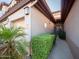 Charming home exterior with well-manicured landscaping, private walkway, and convenient garage access at 6535 E Superstition Springs Blvd # 217, Mesa, AZ 85206