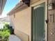 Close up of a green front door with address number in a stucco building at 6535 E Superstition Springs Blvd # 217, Mesa, AZ 85206