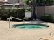 Hot tub with tile accents and railings for easy access at 6535 E Superstition Springs Blvd # 217, Mesa, AZ 85206