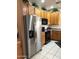Kitchen featuring stainless steel appliances, wooden cabinets, and modern countertops at 6535 E Superstition Springs Blvd # 217, Mesa, AZ 85206