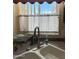 Close up of a double basin kitchen sink with window at 6535 E Superstition Springs Blvd # 217, Mesa, AZ 85206