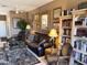 Living room featuring sofa and bookshelves at 6535 E Superstition Springs Blvd # 217, Mesa, AZ 85206