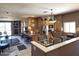 Open living and kitchen area with tile flooring and neutral color palette at 6535 E Superstition Springs Blvd # 217, Mesa, AZ 85206