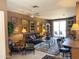 Cozy living room with a ceiling fan, large windows, and a decorative rug at 6535 E Superstition Springs Blvd # 217, Mesa, AZ 85206