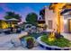 Beautiful backyard with a pool, waterfall, and lots of lush landscaping around the tanning area at 6701 N Scottsdale Rd # 26, Scottsdale, AZ 85250