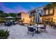 Backyard oasis featuring a pool with waterfall, covered patio and seating areas, great for entertaining guests at 6701 N Scottsdale Rd # 26, Scottsdale, AZ 85250