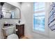 Well-lit bathroom with a modern vanity, white subway tile, and stylish mirror at 6701 N Scottsdale Rd # 26, Scottsdale, AZ 85250