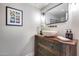 Charming powder room with furniture-style vanity and vessel sink at 6701 N Scottsdale Rd # 26, Scottsdale, AZ 85250