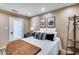 Comfortable bedroom with natural light, art decor, and neutral walls at 6701 N Scottsdale Rd # 26, Scottsdale, AZ 85250