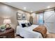 Cozy bedroom with natural light, stylish decor, and a sliding barn door at 6701 N Scottsdale Rd # 26, Scottsdale, AZ 85250