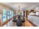 Elegant dining room with a large wood table with French doors leading to the pool at 6701 N Scottsdale Rd # 26, Scottsdale, AZ 85250