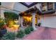 Charming front porch featuring decorative planters, a tiered fountain, and cozy seating, creating an inviting entrance at 6701 N Scottsdale Rd # 26, Scottsdale, AZ 85250