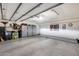 Spacious three car garage with lots of storage, painted floors, and lighting at 6701 N Scottsdale Rd # 26, Scottsdale, AZ 85250