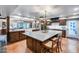 Spacious kitchen with a large center island, wood cabinets, modern appliances, and a farmhouse sink at 6701 N Scottsdale Rd # 26, Scottsdale, AZ 85250