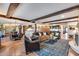 Spacious living area open to the dining room and kitchen, featuring exposed beams at 6701 N Scottsdale Rd # 26, Scottsdale, AZ 85250