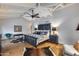Spacious main bedroom featuring a high ceiling, wood beams, ceiling fan, and hardwood floors at 6701 N Scottsdale Rd # 26, Scottsdale, AZ 85250