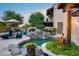 Beautiful backyard pool with cascading waterfall, surrounded by lush landscaping, creating a serene outdoor escape at 6701 N Scottsdale Rd # 26, Scottsdale, AZ 85250