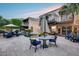 Resort-style backyard showcasing a pool with a waterfall, comfortable lounge seating, and a dining set for outdoor enjoyment at 6701 N Scottsdale Rd # 26, Scottsdale, AZ 85250