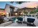 Inviting backyard oasis featuring a beautiful pool, luxurious lounge chairs, and a shaded dining area for outdoor gatherings at 6701 N Scottsdale Rd # 26, Scottsdale, AZ 85250