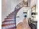 Elegant staircase featuring decorative tile risers and wrought iron railing under chandelier at 6701 N Scottsdale Rd # 26, Scottsdale, AZ 85250