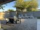 Backyard patio area perfect for outdoor entertaining with chairs and a table at 694 W Park Ave, Chandler, AZ 85225