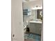 Bathroom featuring vanity with a granite countertop, lighting fixtures, and a commode at 694 W Park Ave, Chandler, AZ 85225