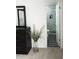 View of primary bathroom with marble shower, patterned flooring, and glass enclosed shower at 694 W Park Ave, Chandler, AZ 85225