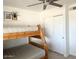 Bedroom featuring rustic bunkbeds, ceiling fan, and closet at 694 W Park Ave, Chandler, AZ 85225