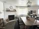 Elegant dining room with brick fireplace, a large table, and stylish decor, perfect for entertaining at 694 W Park Ave, Chandler, AZ 85225