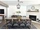 Elegant dining room with brick fireplace, a large table, and stylish decor, perfect for entertaining at 694 W Park Ave, Chandler, AZ 85225