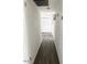 Hallway with luxury vinyl flooring and white doors for privacy at 694 W Park Ave, Chandler, AZ 85225