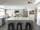 Well-lit kitchen featuring a large island, modern appliances, and stylish gray cabinets, perfect for cooking at 694 W Park Ave, Chandler, AZ 85225